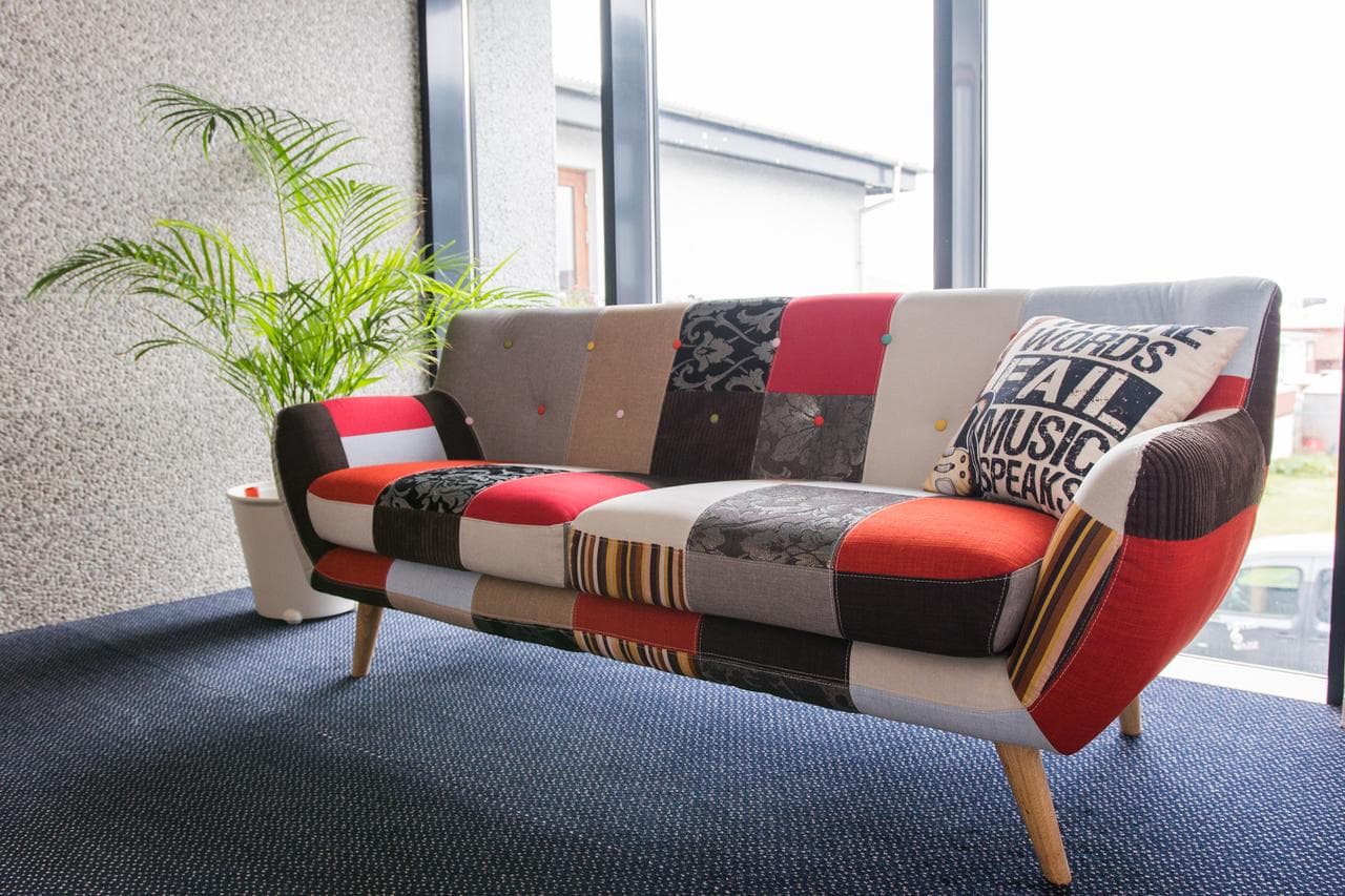Colourful patchwork sofa in the lounge at Hotel Jazz