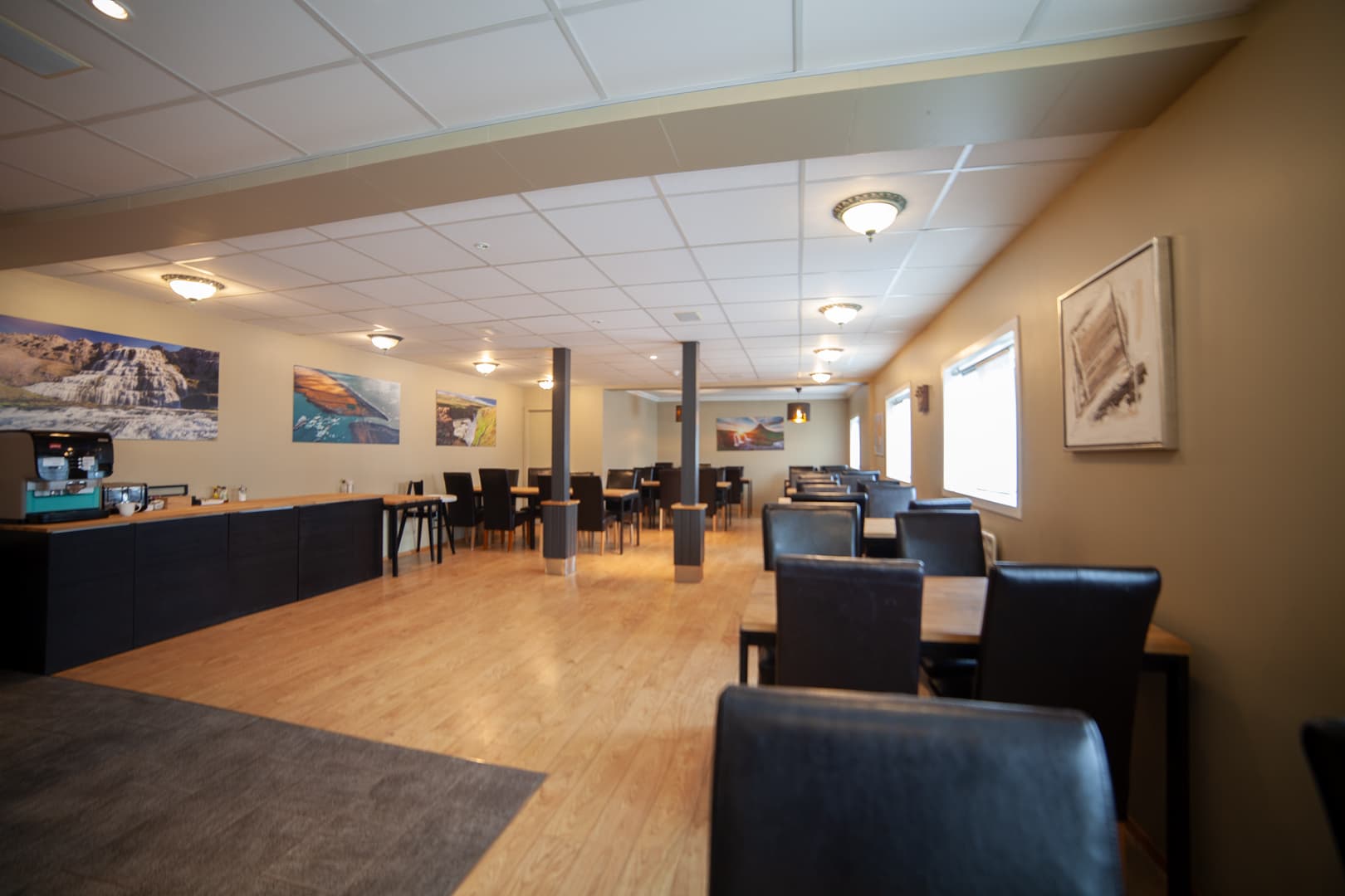 Spacious dining area with photographs of Iceland on the walls