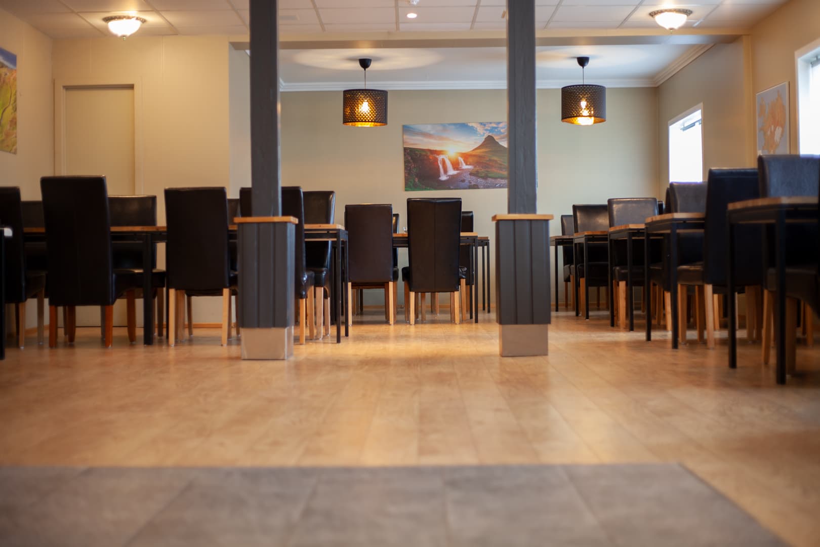 Dining room with wooden tables and dark chairs