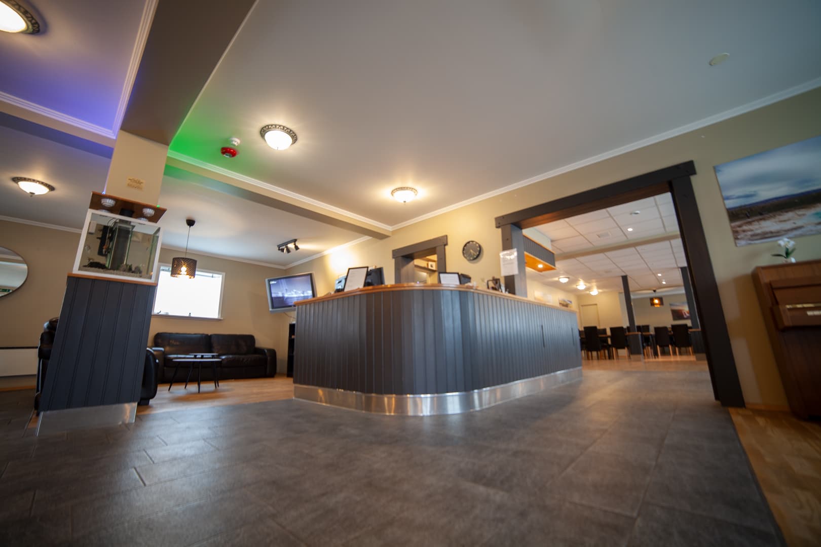 Reception desk and lounge area with a TV