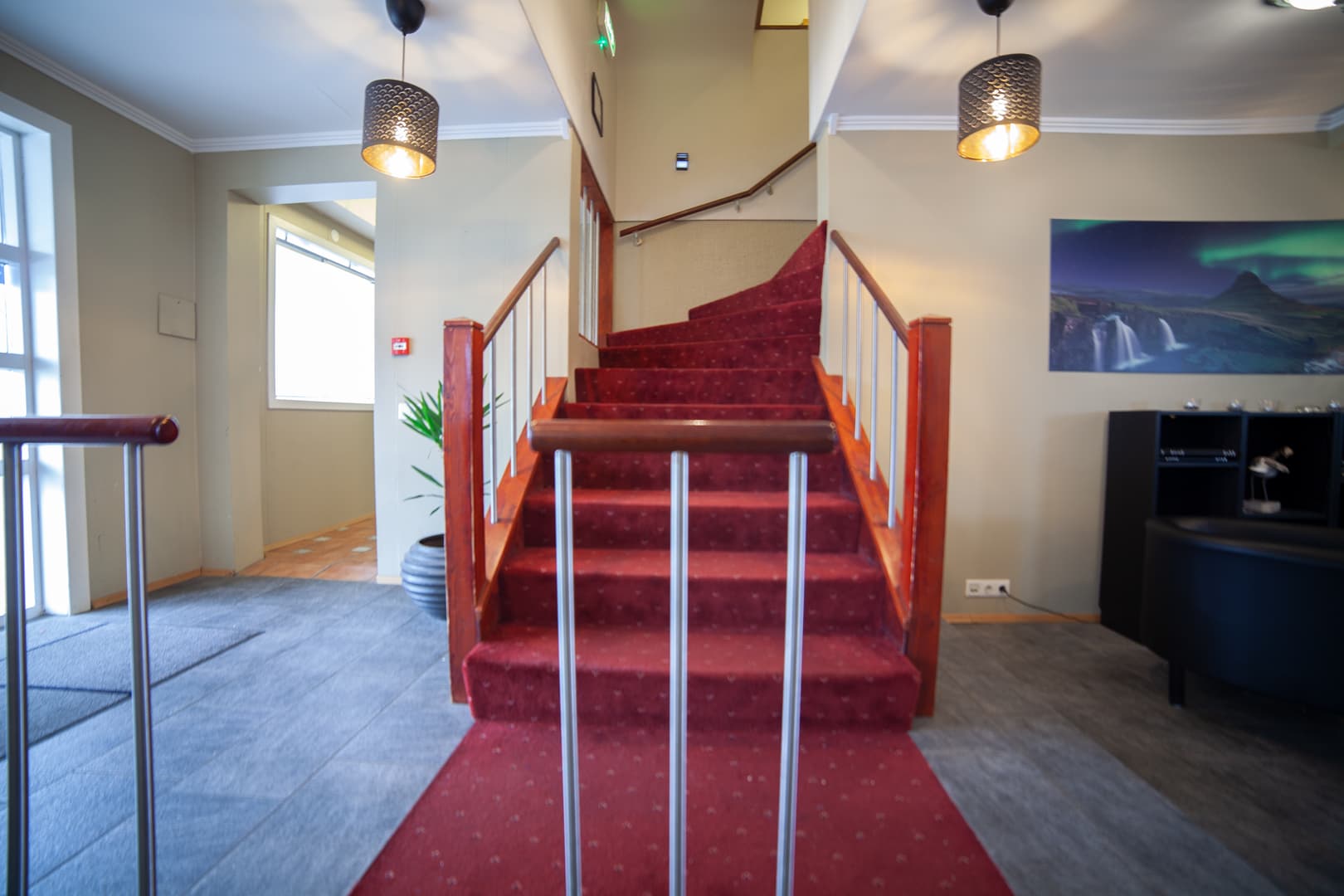 Entrance hall with a red carpeted staircase